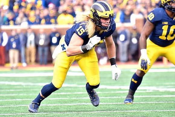 Chase Winovich (15) and Devin Bush (10)