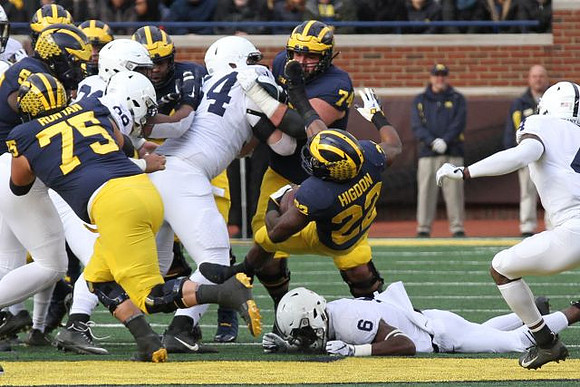 Jon Runyan Jr. (75), Ben Bredeson (74), and Karan Higdon (22)