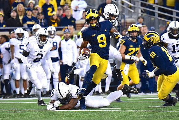 Donovan Peoples-Jones (9), Joe Hewlett (27), and Devin Bush (10)