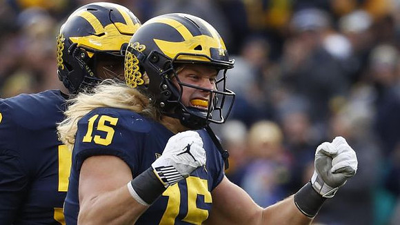 Chase Winovich (15) and Michael Dwumfour (50)