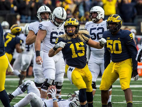 Chase Winovich (15) and Michael Dwumfour (50)