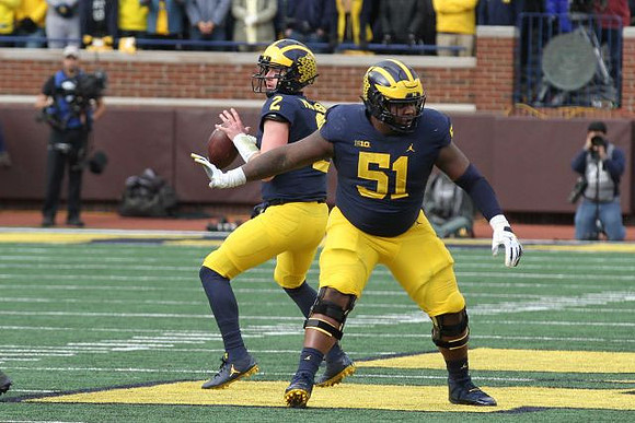 Shea Patterson (2) and Cesar Ruiz (51)