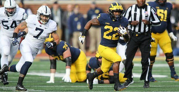 Ben Bredeson (74), Karan Higdon (22), and Cesar Ruiz (51)