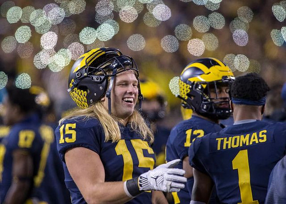 Chase Winovich (15), Josh Ross (12), and Ambry Thomas (1)