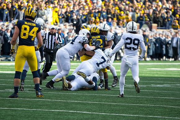 Sean McKeon (84) and Karan Higdon (22)