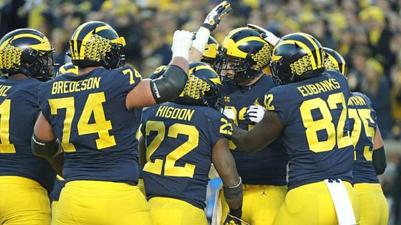 Cesar Ruiz (51), Ben Bredeson (74), Karan Higdon (22), Zach Gentry (83), Nick Eubanks (82), and Jon Runyan Jr. (75)