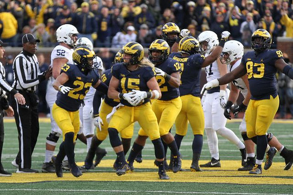 Tyree Kinnel (23), Chase Winovich (15), Kwity Paye (19), Josh Ross (12), Khaleke Hudson (7), and Lawrence Marshall (93)