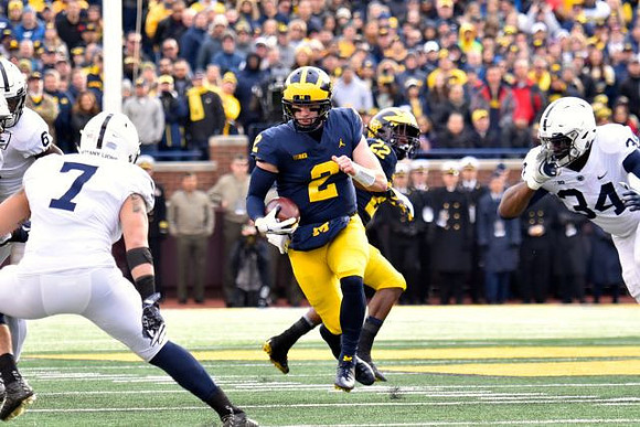 Shea Patterson (2) and Karan Higdon (22)