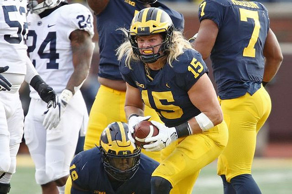 Kwity Paye (19), Chase Winovich (15), and Khaleke Hudson (7)
