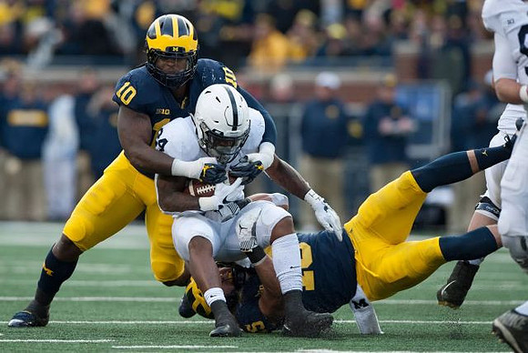 Devin Bush (10) and Chase Winovich (15)