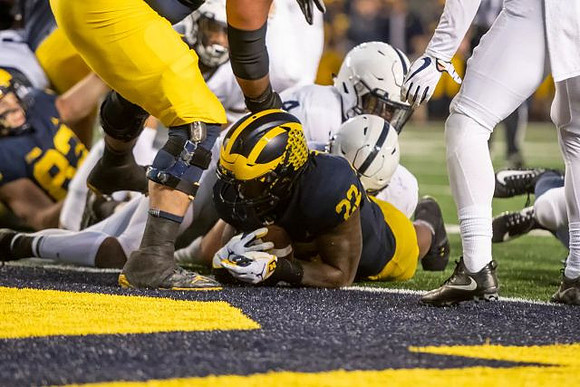 Zach Gentry (83) and Karan Higdon (22)