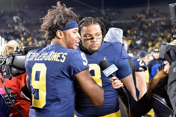 Donovan Peoples-Jones (9) and Rashan Gary (3)