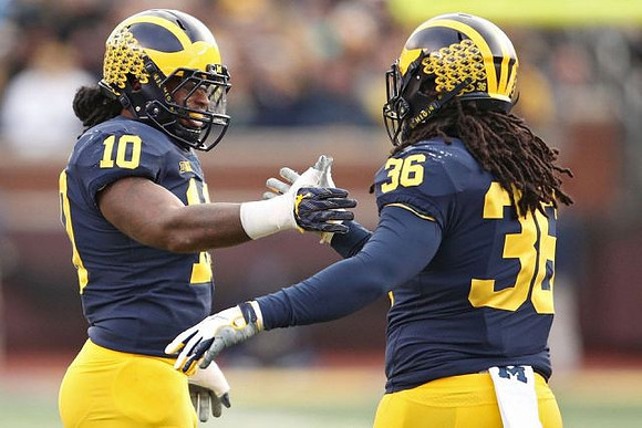 Devin Bush (10) and Devin Gil (36)