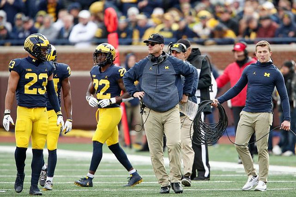 Tyree Kinnel (23), David Long (22), Jim Harbaugh, and Michael Zordich