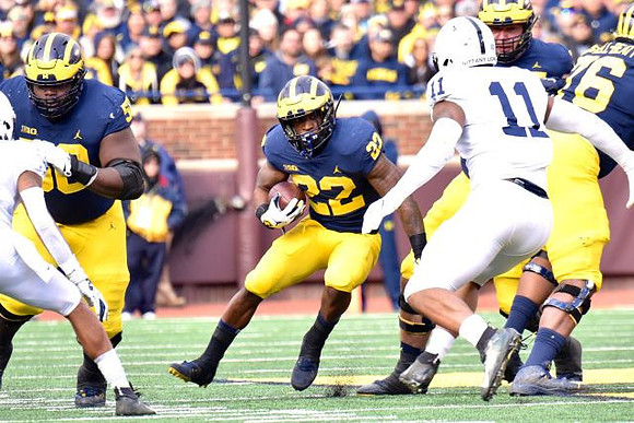 Michael Onwenu (50), Karan Higdon (22), Ben Bredeson (74), and Juwann Bushell-Beatty (76)