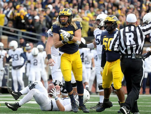 Chase Winovich (15) and Michael Dwumfour (50)