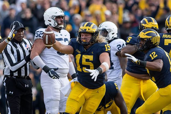 Chase Winovich (15), Aubrey Solomon (5), Josh Ross (12), and Khaleke Hudson (7)