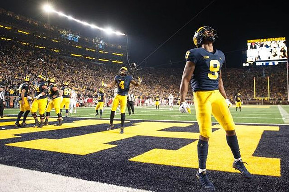 Donovan Peoples-Jones (9), Nico Collins (4), and Michigan Team
