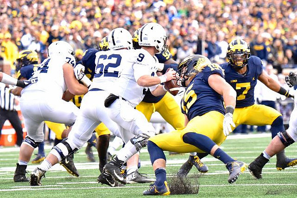 Chase Winovich (15) and Khaleke Hudson (7)