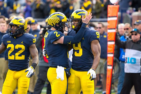 Karan Higdon (22), Shea Patterson (2), and Donovan Peoples-Jones (9)