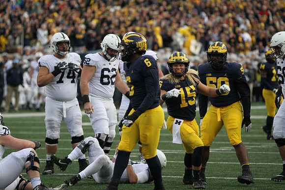 Josh Uche (6), Chase Winovich (15), Michael Dwumfour (50), and Josh Metellus (14)