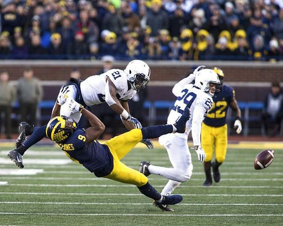 Donovan Peoples-Jones (9) and Karan Higdon (22)