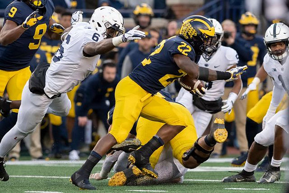 Donovan Peoples-Jones (9) and Karan Higdon (22)