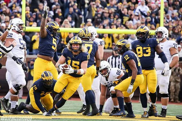 Kwity Paye (19), Aubrey Solomon (5), Chase Winovich (15), Khaleke Hudson (7), Josh Ross (12), and Lawrence Marshall (93)