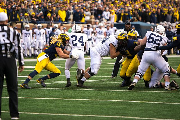 Chase Winovich (15), Rashan Gary (3), and Michael Dwumfour (50)