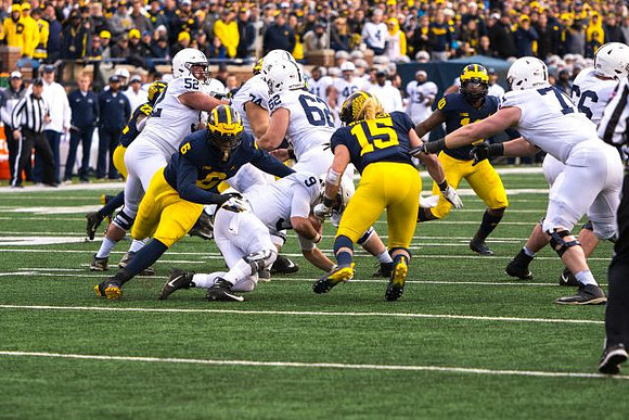 David Long (22), Josh Uche (6), Chase Winovich (15), and Devin Bush (10)