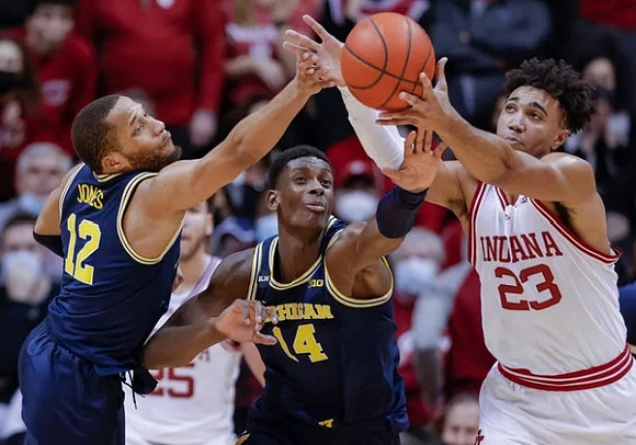 DeVante' Jones (12) and Moussa Diabate (14)