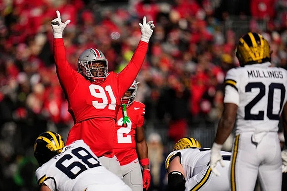 Josh Priebe (68) and Kalel Mullings (20)