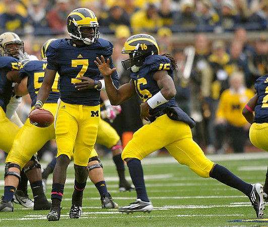 Ricky Barnum (52), David Molk (50), Devin Gardner (7), and Denard Robinson (16)