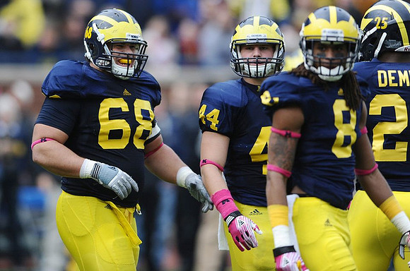 Mike Martin (68), Desmond Morgan (44), J.T. Floyd (8), and Kenny Demens (25)