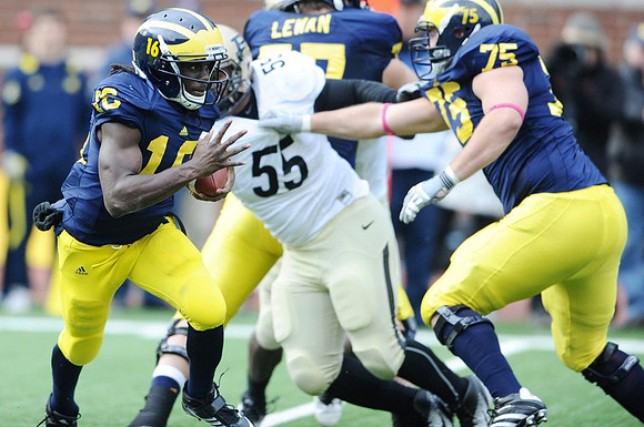 Denard Robinson (16), Taylor Lewan (77), and Michael Schofield (75)