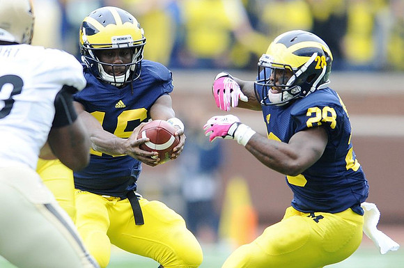 Denard Robinson (16) and Fitzgerald Toussaint (28)