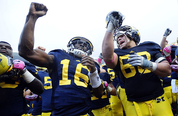 Denard Robinson (16) and Mike Martin (68)