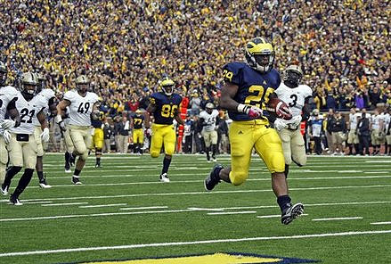 Kevin Koger (86) and Fitzgerald Toussaint (28)