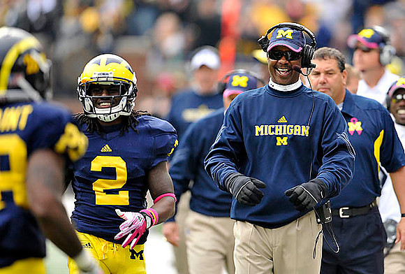 Fitzgerald Toussaint (28), Vincent Smith (2), Fred Jackson, and Brady Hoke