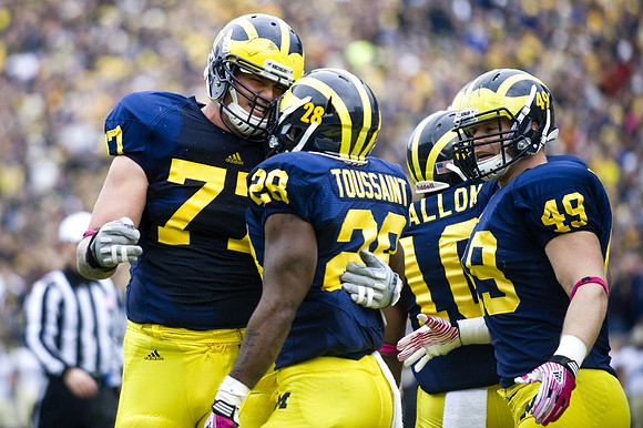 Taylor Lewan (77), Fitzgerald Toussaint (28), Jeremy Gallon (10), and John McColgan (49)