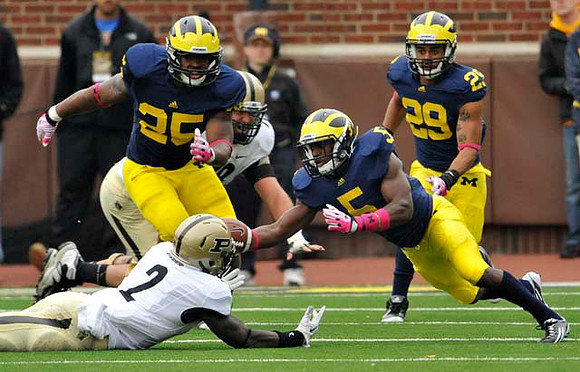 Kenny Demens (25), Courtney Avery (5), and Troy Woolfolk (29)