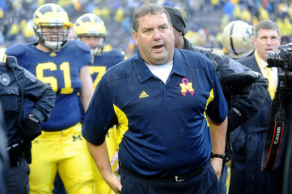 Graham Glasgow (61), Brady Hoke, and David Brandon
