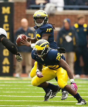 Denard Robinson (16) and Fitzgerald Toussaint (28)