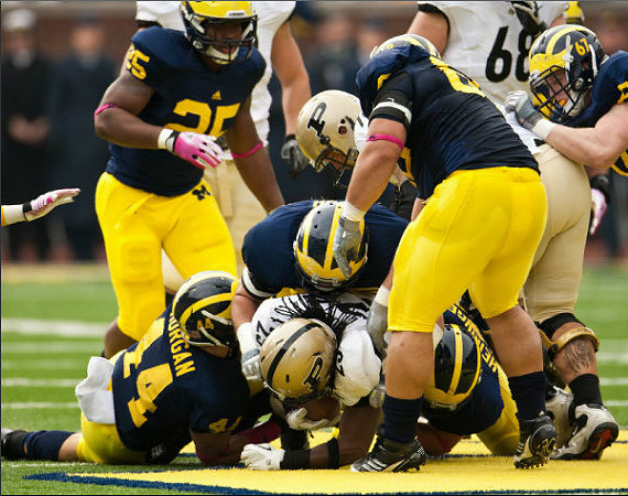 Kenny Demens (25), Desmond Morgan (44), Will Heininger (39), Ryan Van Bergen (53), Mike Martin (68), and Nathan Brink (67)