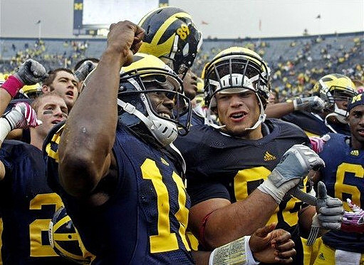 Denard Robinson (16) and Mike Martin (68)