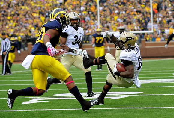 Jeremy Gallon (10) and Taylor Lewan (77)