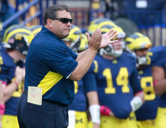 Jared Van Slyke (31), Brady Hoke, and Jack Kennedy (14)
