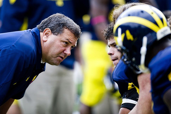 Brady Hoke, Mike Martin (68), and Cameron Gordon (4)