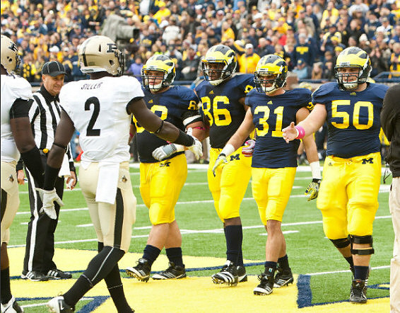 Mike Martin (68), Kevin Koger (86), Jared Van Slyke (31), and David Molk (50)