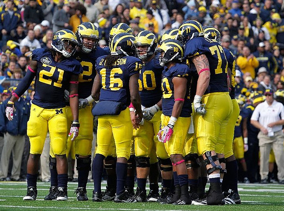 Junior Hemingway (21), Mark Huyge (72), Denard Robinson (16), David Molk (50), Jeremy Gallon (10), Taylor Lewan (77), and Kevin Koger (86)